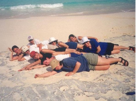 Students laying in the sand