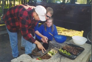 Dave Sunderlin, Brian Flynn and Cathy Bosek prepare 'kabobs' at Crown Point Campground. 