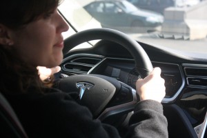 Elise Van Gelder '15 behind the wheel of the Model S.