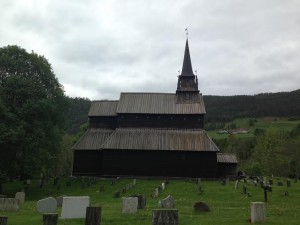 A side view of the stave church including the cemetery on the grounds
