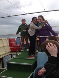 Students hug on the boat