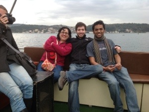 Students on a boat with Professor Khan