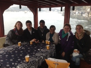 Group of students at a table on the boat