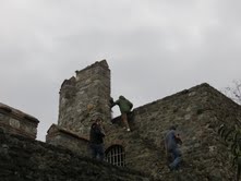 Christopher Donnelly and Colin Shipley scale the walls of the fortress.