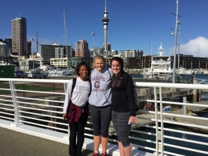 Randyll Butler '16, Summer King '19 and Julia Barcello '18 with the Sky Tower in the background.