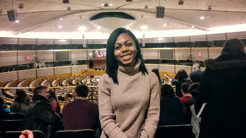 I'm smiling because I'm excited to be inside of the European Parliament!
