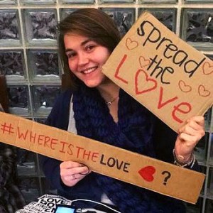 Providence Ryan '16 with Spread the Love protest signs