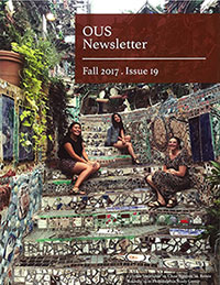 Cover of the newsletter featuring three students sitting on scenic stone steps