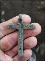 Figure 4: Cross pendant discovered during excavation.