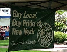 Sign reading "Buy Local, Buy Pride of New York"