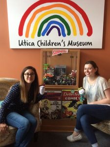 Dylann McLaughlin, '18 (left) and Lindsey Johnson, '20 (right) sitting and posing with small stuffed animals at the Utica Children's Museum