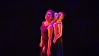 Arch concert dancers in pink light